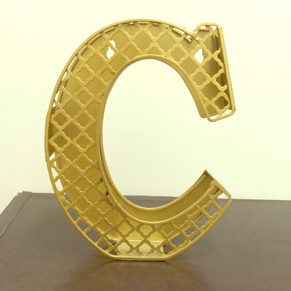 Tj maxx “C” sign